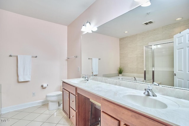 10410 Rosegate Ct Unit 105, Raleigh, NC 27617 - full bath featuring double vanity, tile patterned floors, a garden tub, and a stall shower