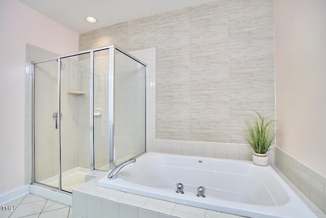 10410 Rosegate Ct Unit 105, Raleigh, NC 27617 - bathroom with a shower stall, a bath, and tile patterned floors