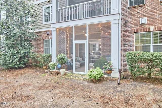 10410 Rosegate Ct Unit 105, Raleigh, NC 27617 - property entrance featuring brick siding and a balcony