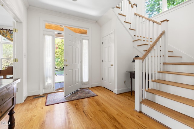 201 Weathervane Dr, Carrboro, NC 27510 - entrance foyer with plenty of natural light, light wood-type flooring, and stairway