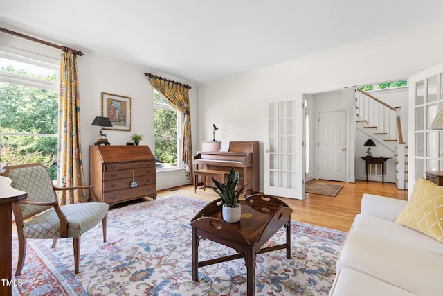 201 Weathervane Dr, Carrboro, NC 27510 - living room with ornamental molding, stairs, and light wood finished floors