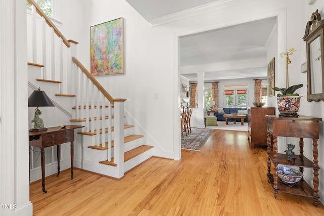 201 Weathervane Dr, Carrboro, NC 27510 - foyer entrance featuring wood finished floors, ornamental molding, stairs, and decorative columns