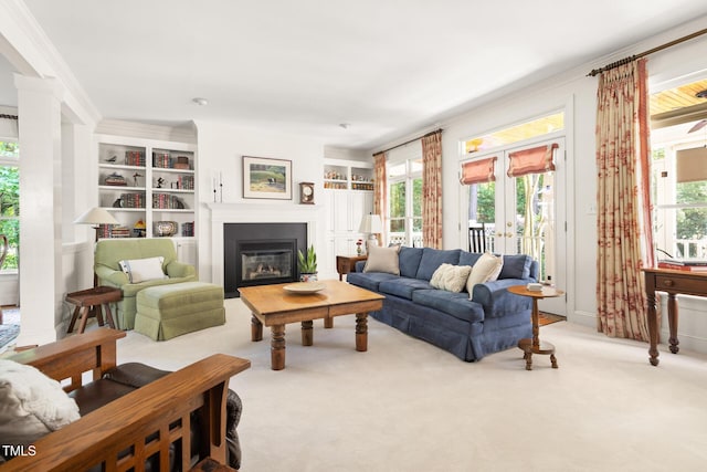 201 Weathervane Dr, Carrboro, NC 27510 - carpeted living room featuring a glass covered fireplace, built in features, and french doors