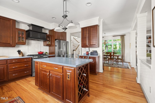 201 Weathervane Dr, Carrboro, NC 27510 - kitchen with appliances with stainless steel finishes, premium range hood, light wood-style flooring, glass insert cabinets, and crown molding