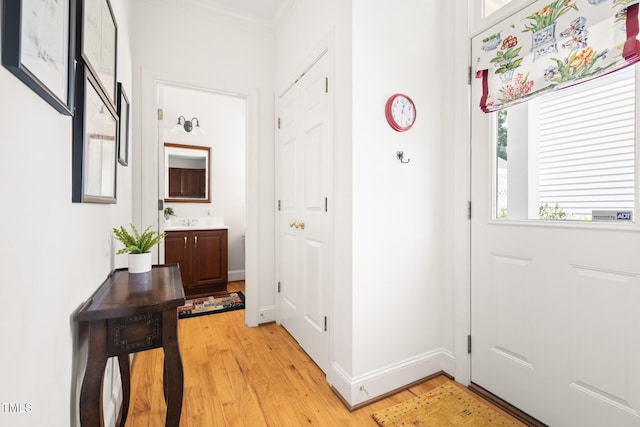 201 Weathervane Dr, Carrboro, NC 27510 - doorway to outside with light wood finished floors and crown molding