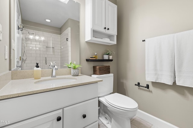 201 Weathervane Dr, Carrboro, NC 27510 - bathroom featuring vanity, a tile shower, and tile patterned floors