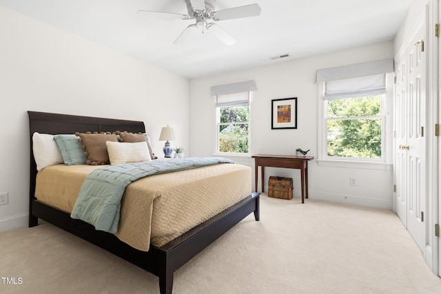 201 Weathervane Dr, Carrboro, NC 27510 - bedroom with light colored carpet and a ceiling fan