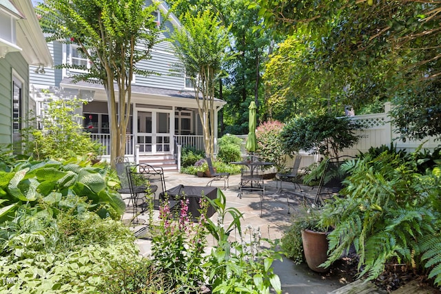 201 Weathervane Dr, Carrboro, NC 27510 - view of patio / terrace featuring outdoor dining area and a sunroom