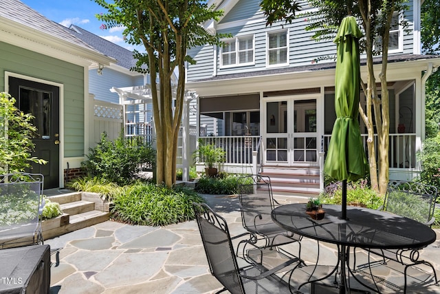 201 Weathervane Dr, Carrboro, NC 27510 - view of patio / terrace featuring a sunroom and outdoor dining area