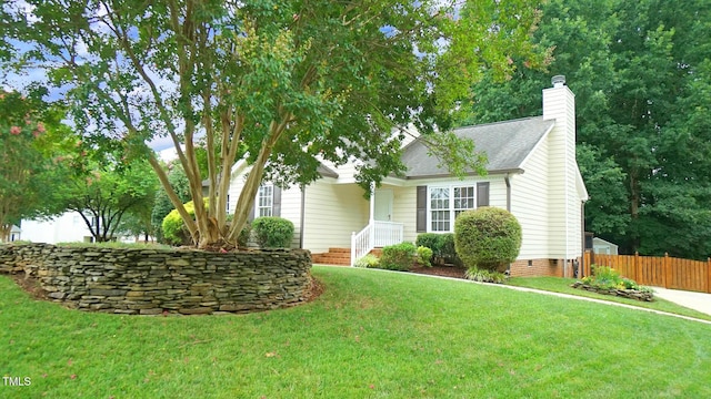 8001 Flanagan Pl, Raleigh, NC 27612 - view of front of house with a chimney, crawl space, and a shingled roof