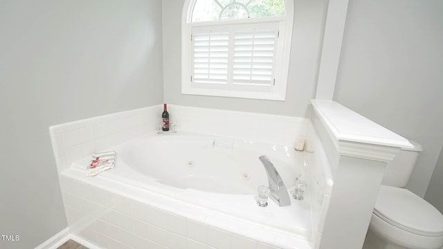 8001 Flanagan Pl, Raleigh, NC 27612 - bathroom featuring a tub with jets and toilet