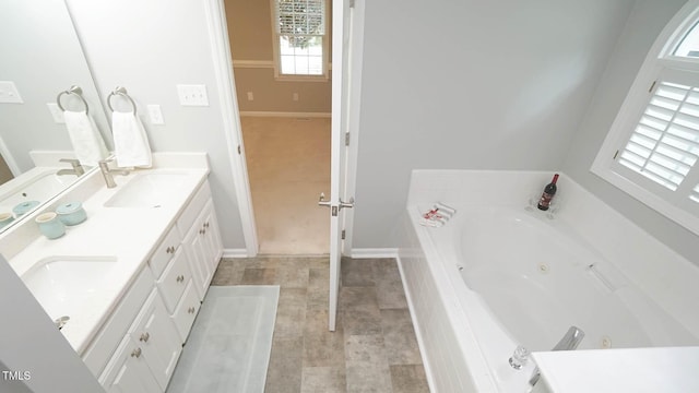8001 Flanagan Pl, Raleigh, NC 27612 - bathroom with double vanity and a tub with jets