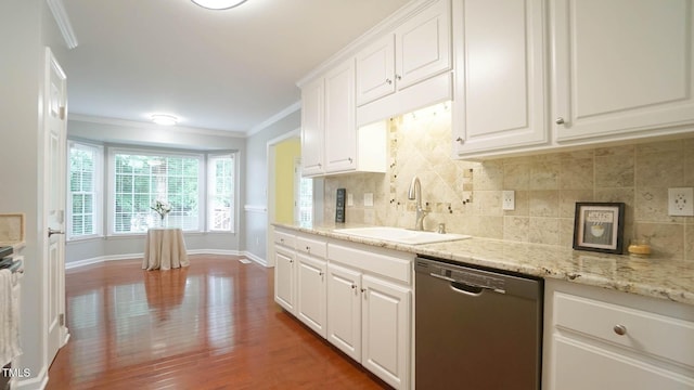8001 Flanagan Pl, Raleigh, NC 27612 - kitchen featuring stainless steel dishwasher, decorative backsplash, white cabinetry, crown molding, and wood finished floors