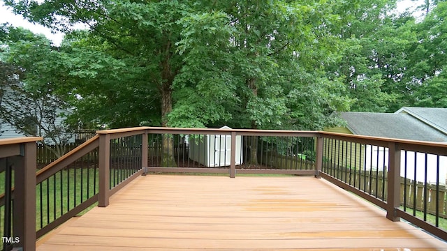 8001 Flanagan Pl, Raleigh, NC 27612 - wooden terrace featuring a shed and a fenced backyard