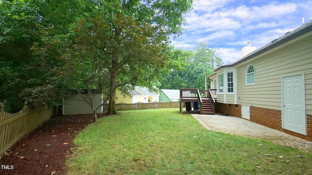 8001 Flanagan Pl, Raleigh, NC 27612 - fenced backyard with a deck, stairs, and a patio area