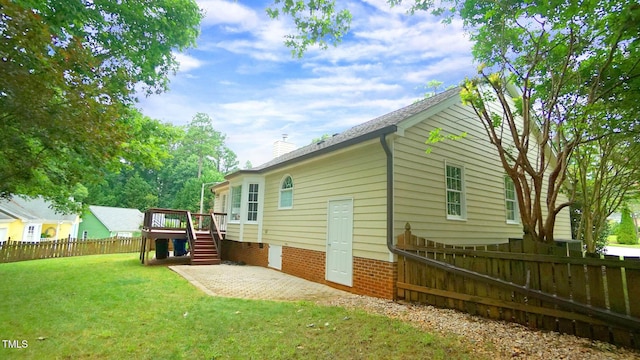 8001 Flanagan Pl, Raleigh, NC 27612 - back of property featuring stairs, a wooden deck, a patio, and a chimney
