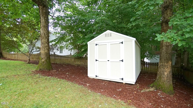 8001 Flanagan Pl, Raleigh, NC 27612 - view of shed with a fenced backyard