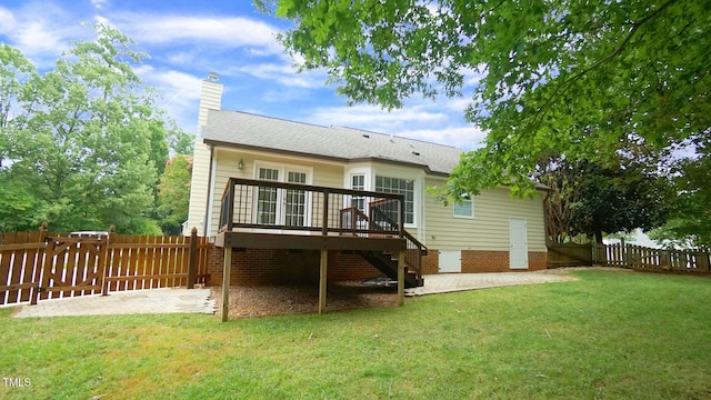 8001 Flanagan Pl, Raleigh, NC 27612 - back of house with a fenced backyard, stairway, a wooden deck, a patio area, and a chimney