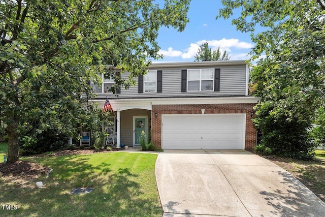 109 Covenant Rock Ln, Holly Springs, NC 27540 - traditional home with a garage, concrete driveway, a front yard, a porch, and brick siding