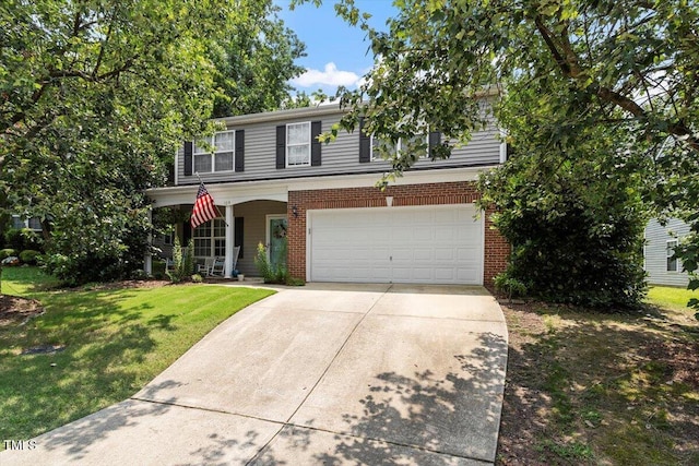 109 Covenant Rock Ln, Holly Springs, NC 27540 - traditional-style house featuring concrete driveway, a garage, a front lawn, brick siding, and a porch