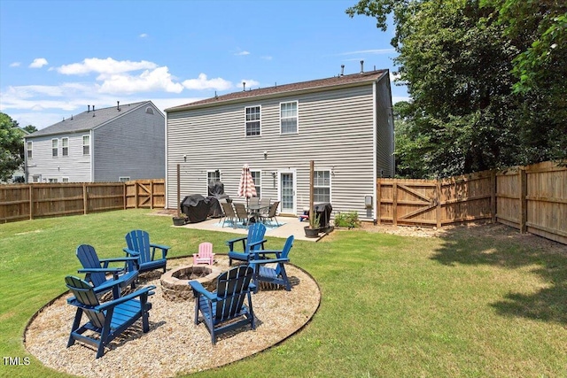 109 Covenant Rock Ln, Holly Springs, NC 27540 - back of house with a fire pit, a patio area, and a fenced backyard