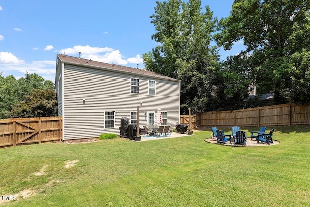 109 Covenant Rock Ln, Holly Springs, NC 27540 - back of property with an outdoor fire pit, a patio area, and a fenced backyard