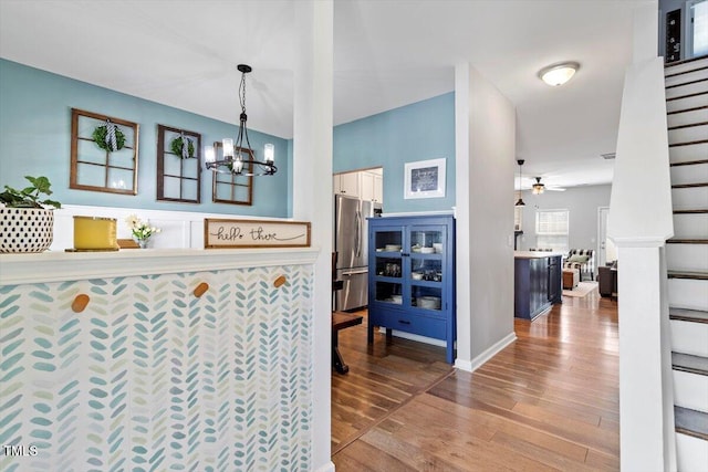 109 Covenant Rock Ln, Holly Springs, NC 27540 - hall featuring a chandelier and wood finished floors