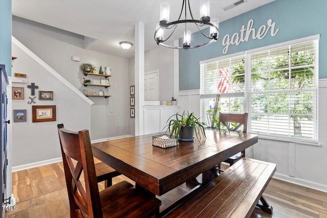 109 Covenant Rock Ln, Holly Springs, NC 27540 - dining area with a chandelier, light wood-type flooring, and plenty of natural light
