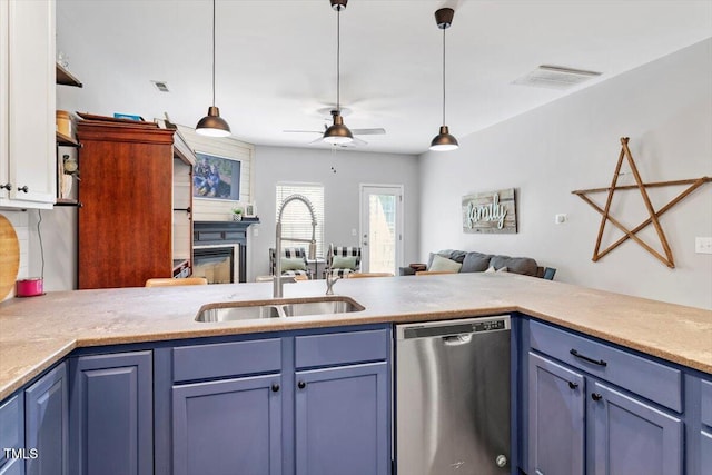 109 Covenant Rock Ln, Holly Springs, NC 27540 - kitchen with dishwasher, ceiling fan, blue cabinets, decorative light fixtures, and light countertops