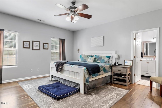 109 Covenant Rock Ln, Holly Springs, NC 27540 - bedroom featuring hardwood / wood-style floors, ensuite bath, and ceiling fan