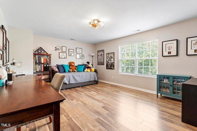 109 Covenant Rock Ln, Holly Springs, NC 27540 - bedroom with light wood-type flooring and a desk