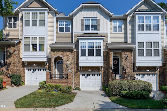 5809 Cameo Glass Way, Raleigh, NC 27612 - craftsman inspired home featuring stone siding, a garage, driveway, and a standing seam roof