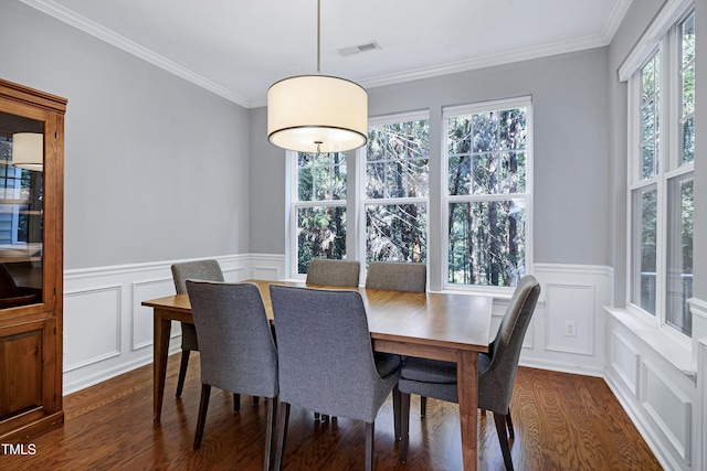 5809 Cameo Glass Way, Raleigh, NC 27612 - dining space featuring dark wood-style flooring, ornamental molding, a decorative wall, and a wainscoted wall