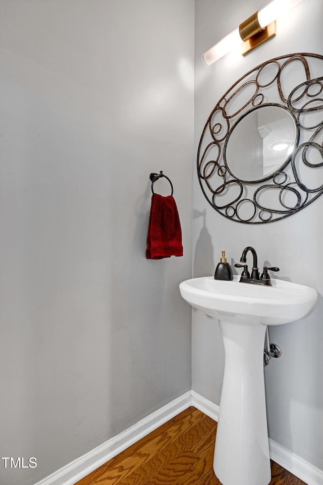 5809 Cameo Glass Way, Raleigh, NC 27612 - bathroom featuring wood finished floors and baseboards