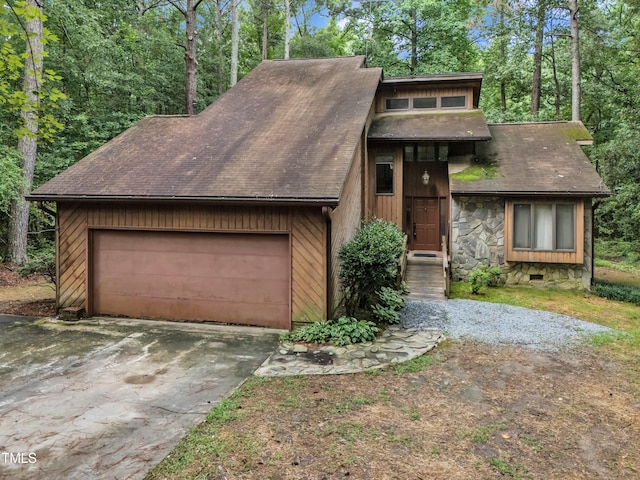 128 Chris Ct, Garner, NC 27529 - view of front of home with a garage, a shingled roof, and stone siding