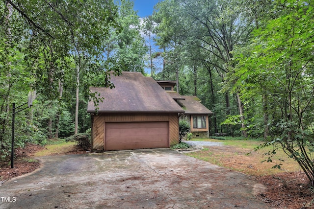 128 Chris Ct, Garner, NC 27529 - view of front of property featuring driveway, a garage, and a shingled roof