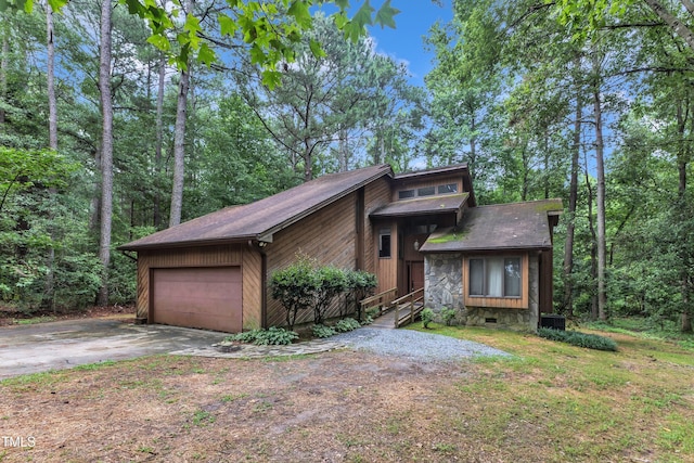 128 Chris Ct, Garner, NC 27529 - mid-century inspired home with concrete driveway and an attached garage