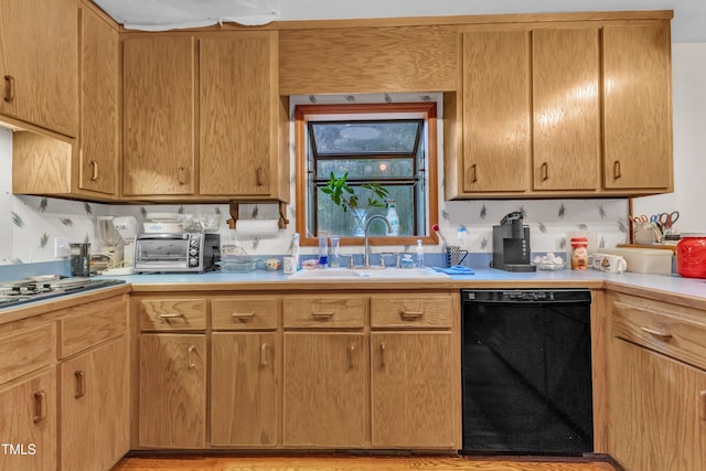 128 Chris Ct, Garner, NC 27529 - kitchen with black dishwasher, light countertops, and stovetop