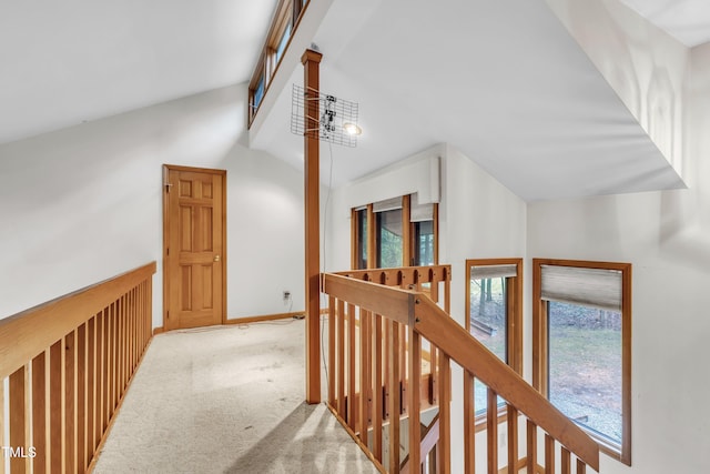 128 Chris Ct, Garner, NC 27529 - hallway featuring lofted ceiling, an upstairs landing, and carpet flooring