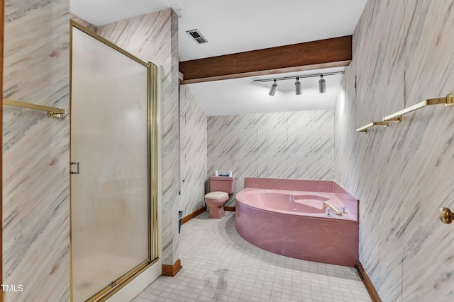 128 Chris Ct, Garner, NC 27529 - bathroom featuring rail lighting, a bath, a stall shower, and tile patterned floors