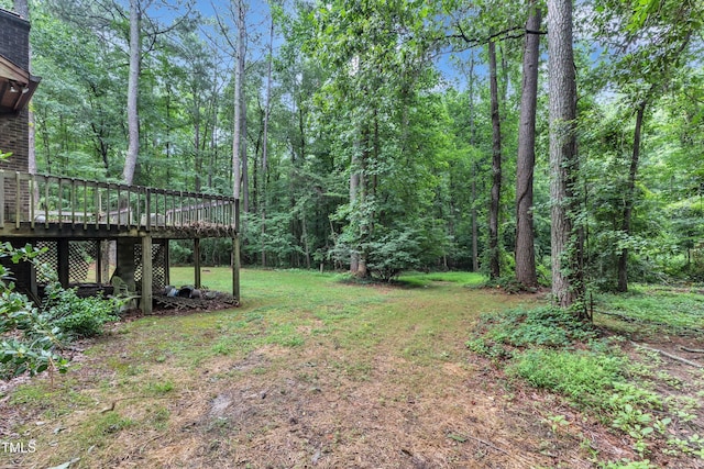 128 Chris Ct, Garner, NC 27529 - view of yard with a wooden deck and a forest view