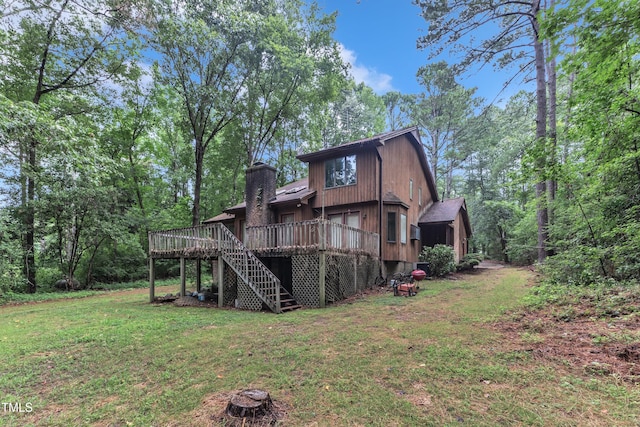128 Chris Ct, Garner, NC 27529 - back of house featuring stairs, a deck, a yard, and a chimney