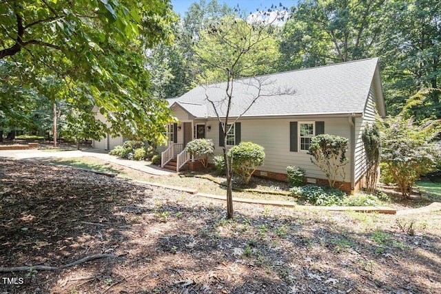 8704 Mill House Ln, Bahama, NC 27503 - view of front of home with roof with shingles, concrete driveway, a garage, and crawl space