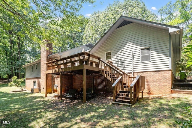 8704 Mill House Ln, Bahama, NC 27503 - rear view of house featuring a wooden deck, stairs, a yard, and a chimney