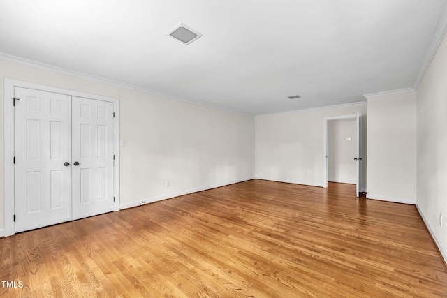 1820 Hunting Ridge Rd, Raleigh, NC 27615 - unfurnished bedroom featuring light wood-style flooring and crown molding