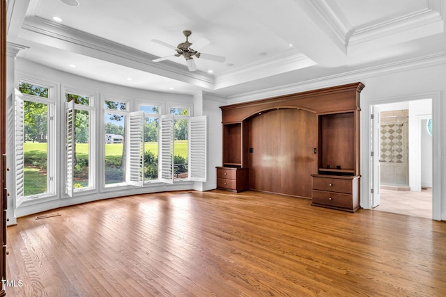 1820 Hunting Ridge Rd, Raleigh, NC 27615 - unfurnished living room with a ceiling fan, healthy amount of natural light, light wood-type flooring, and crown molding