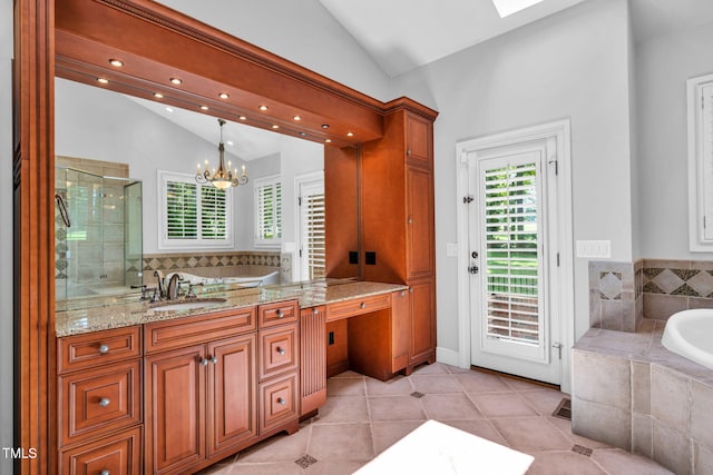 1820 Hunting Ridge Rd, Raleigh, NC 27615 - full bathroom with lofted ceiling, vanity, a shower stall, a bath, and a chandelier