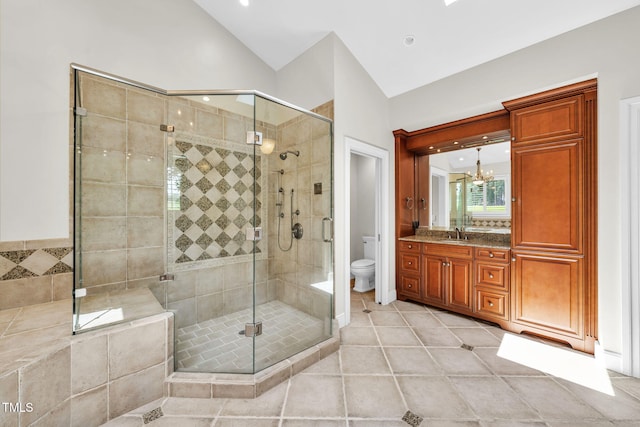 1820 Hunting Ridge Rd, Raleigh, NC 27615 - bathroom with vaulted ceiling, tile patterned floors, a stall shower, a chandelier, and vanity