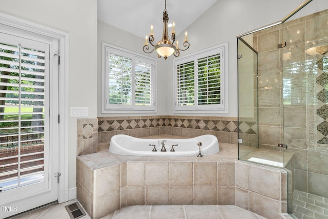 1820 Hunting Ridge Rd, Raleigh, NC 27615 - full bathroom with a garden tub, a shower stall, a chandelier, and tile patterned flooring