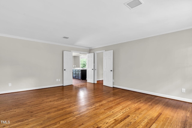 1820 Hunting Ridge Rd, Raleigh, NC 27615 - unfurnished room with wood finished floors and crown molding
